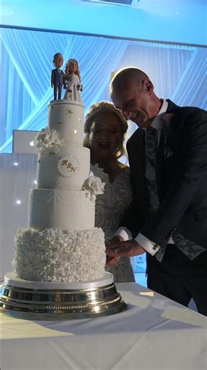 Couple cutting their wedding cake