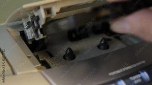 replacing audio cassettes in the player