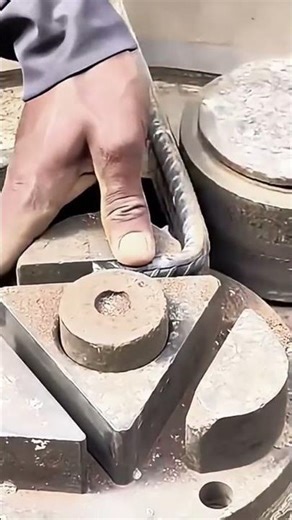 bending a long rusty metal rebar into a sharp angle using a manual industrial bending tool today