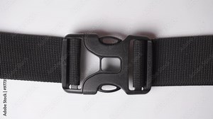 Backpack buckle. Black dual quick release buckle, closed and opened