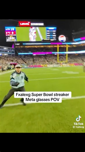 Dustin Ramos-Sundstrom on Instagram: "Streaker POV: Super Bowl Sunday wearing @metaglasses @meta Super Bowl chaos from a first-person point of view 👀🏈 This POV footage shows Alex Gonzales on the field wearing Meta smart glasses, capturing the moment from his perspective as he ran across the field during the game. Viewers online noticed writing across his body, which appears to reference a message or stunt, though the exact wording has not been officially confirmed. It looks like it said “Trade