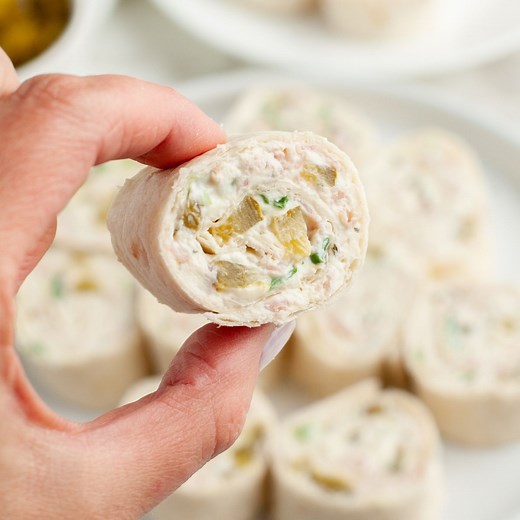 Dill Pickle Pinwheels - A simple, flavorful appetizer or snack. Made with dill pickles, ham, and cream cheese, these are always a favorite! #dillpicklepinwheels #dillpickles #pinwheelrecipes #pinwheels #pickles | Foodlovinfamily