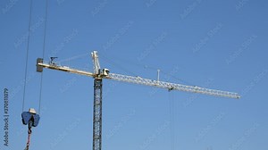 Construction crane in action, grue, crane, equipment, machinery, industry, engineering, work, urban development, building, structure, machine, construction site.