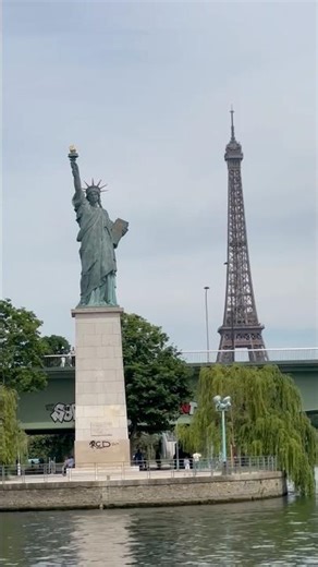 Statue of Liberty & Eiffel Tower on Seine River in Paris, France
