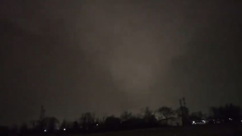 Terrifying tornado strikes Aurora, Illinois, illuminated by lightning