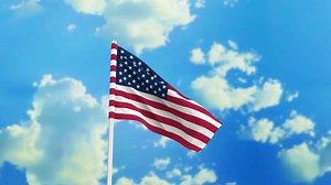 Download USA flag waving in the wind against a sky background for free