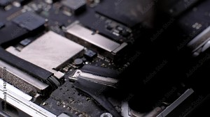 Computer Service. Master cleans the inside of the laptop with dust and other dirt. 4k. Close up. Tech Support Electronic Devices Concept.