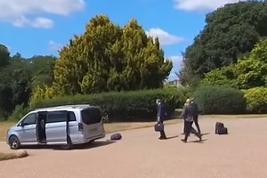 Moment Macron’s car speeds away from Windsor Castle as luggage goes flying from open boot