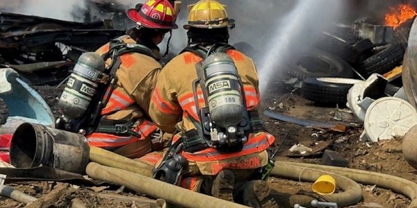 Firefighters respond to 4-alarm tire fire at salvage yard near Woodburn