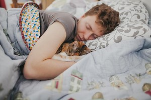 6 Surprising Reasons Your Cat Sleeps Pressed Against You | LoveToKnow Pets