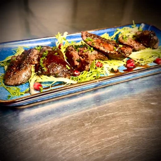 Pan-fried chicken livers with crisp frisée, finished with a sharp-sweet pomegranate glaze. Rich, earthy, and fresh all at once, perfect with a glass of red. #ChickenLivers #PanFried #SeasonalSpecial #FriseeSalad #PomegranateGlaze | The Good Intent