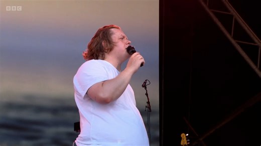 Lewis Capaldi has a Tourette's attack on stage, fans realise and carry him the rest of the way through "Someone You Loved" at Glastonbury