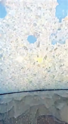 Dashcam Captures Avalanche Crashing Down Snowy Colorado Mountains Colorado--Dashcam footage recorded in Colorado shows a powerful avalanche breaking loose from snow-covered mountains and rushing downhill toward a roadway below. The video captures traffic slowed or stopped as a massive wall of snow and debris suddenly pours down the slope, rapidly reducing visibility and creating dangerous conditions. As the avalanche intensifies, blowing snow engulfs the area while drivers remain stopped at a sa