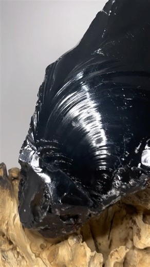 Lumiere Crystals on Instagram: "Black obsidian is a natural volcanic glass, formed from rapidly cooled lava, known for its deep black color and sharp, glassy fracture, historically used for tools like arrowheads and metaphysically seen as a powerful stone for protection, grounding, and revealing truth by cutting through illusions and negativity. This statement piece (shown here on wood stand) is 8.043kg and is 35cm x 20cm and $240 without the stand."