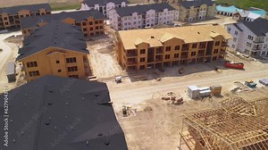 Aerial Drone Orbit View of Apartment Homes Roof Trusses - Residential Building Construction Site In Austin, Texas, USA