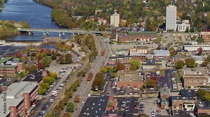 Manchester New Hampshire Aerial v7 Low looking birdseye to wide panoramic view of downtown cityscape - October 2017