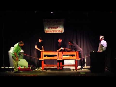 Illusionist Howard Blackwell performing the Wakeling Sawing