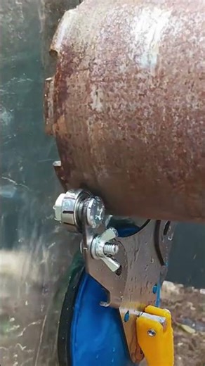 This is a large glass that is being perforated using a special tool with a neat result