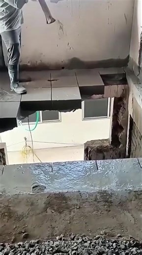 the process of breaking down floor tiles on a ceramic floor.