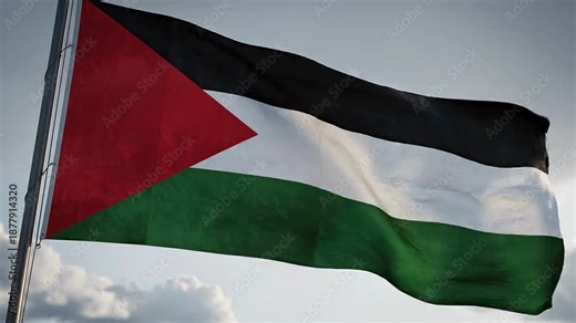 Palestinian national flag waving against a soft sky. Symbol of Palestinian identity, heritage, and Middle Eastern struggle.
