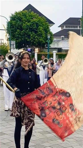 Beautiful Girl Throwing Color Guard Flag