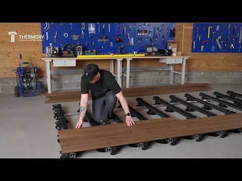 Thermory ash decking installation - D45J profile installed with PaCS Grad Alu Rail 56