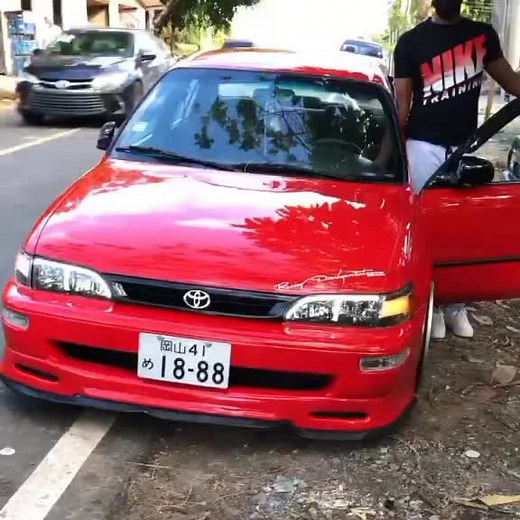 Red Toyota Corolla: Glossy Finish and Urban Vibes