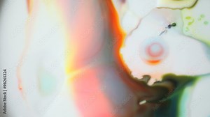 An area of mixed paint colors explodes outward, setting other areas in motion.