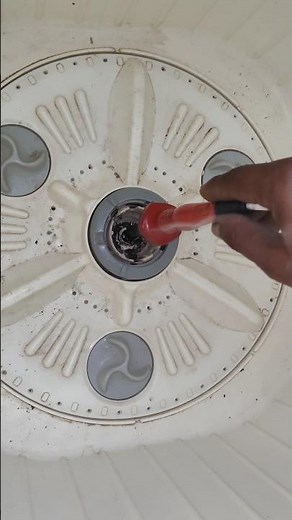 Remove the screw in the pulsator of the washing machine/trick
