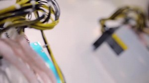 Cryptocurrency mining equipment - ASIC - application specific integrated circuit on farm stand at expo or exhibition