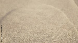 Sand falling down dune in desert