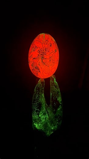 Aliencarvings | 🥚 An engraved translucent egg with depictions of beings, tridents, and ships beneath a radiant disc possibly a stylized “sun” or UFO.... | Instagram