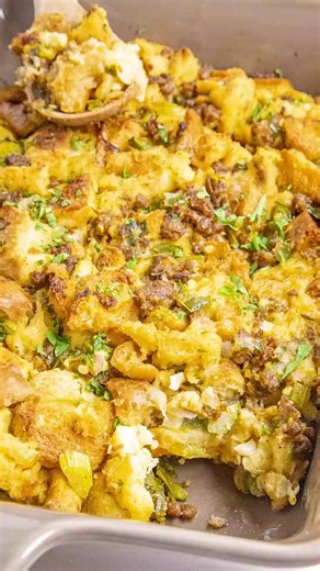 This sausage stuffing recipe is loaded with savory sausage, herbs, seasonings, and cubed bread, the perfect stuffing for your turkey or Easter side dish. Ingredients: 24 ounce loaf of soft white bread cubed 1 tablespoon olive oil 1 pound spicy Italian Sausage use mild for less spicy 8 tablespoons butter 1 medium onion chopped 2 jalapeno peppers chopped (use bell pepper for less spicy) 2 stalks celery chopped 4 cloves garlic chopped (or more as desired) 2 tablespoons Cajun seasoning blend Salt an