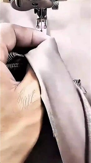 The Process Of Sewing Fabric Edges Manually Using Industrial Overlock Machine