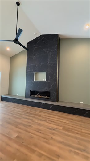 Curington Homes on Instagram: "From drywall to finished feature wall! This custom fireplace started as a vision, and now it’s the heart of the room. We went with a sleek gas linear fireplace, floor-to-ceiling large format tile, and a poured concrete hearth that adds just the right touch of modern texture on both sides. Simple. Striking. Built to feel like home. #CustomHomes #FireplaceDesign #ModernFireplace #OcalaBuilder #CuringtonHomes #DesignBuild #HomeInspo #FeatureWall #InteriorDesignDetails