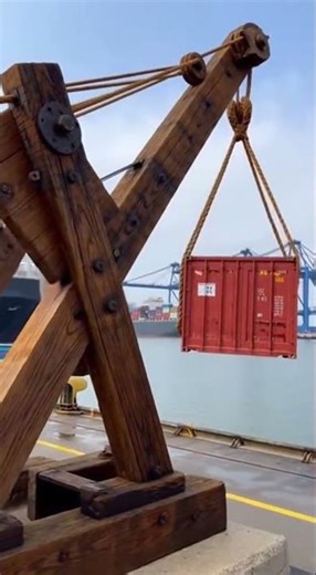 ⚓ Ancient counterweights loading modern cargo, balance beats power.