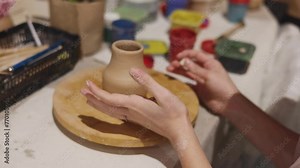 Pottery lesson master class for kids children, process of making clay pot on pottery wheel, potter hands creating ceramic crockery handcrafts, ceramist molding and painting jar or vase
