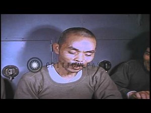 Japanese prisoners seated at a table eating food aboard USS Skate underway in the...HD Stock Footage