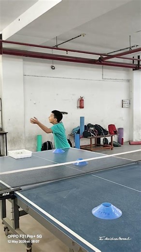 Table tennis side spin service.