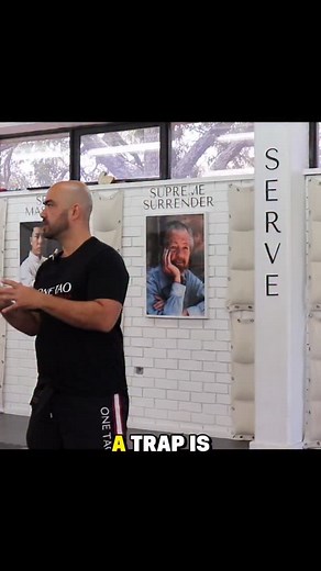 2.8K views · 43 reactions | A trap is when you control both of their arms with one of yours. You learn it in sticky hands so it feels natural. Cover two attack lines with one hand. That gives you the opening to hit with power. Type **LESSONS** to get the full trap drill. | Sifu John Cogan | Facebook