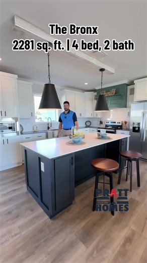 Leaving Monday! The Bronx: Your Dream Prefab Home! ✨🏡 Step into luxury and comfort with Pratt Homes' popular home, the Bronx! This stunning prefab home boasts curb appeal deluxe, featuring beautiful transom windows that create an open and airy atmosphere. As you enter, you'll be greeted by a cozy yet spacious living room adorned with a unique tray ceiling and exposed beams. The electric fireplace nestled between built-in shelving adds warmth and charm to your living space. The heart of the home