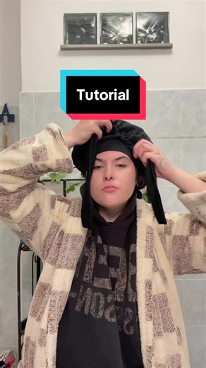 How I’ve been putting my bonnet on, learning from a bunch of TikTok’s lol. But basically your hair should be gently pressed by the bonnet kind of as you’d do with a diffuser air dryer. Put your head down and place your hair in the bonnet like a bag, and then secure with a tie, if you have one. Usually the ones without the tie don’t stay during the night so well though.. at the end your hair should be sitting on top of your head, therefore you wouldn’t be sleeping on top of it. #bonnet #bonnettut