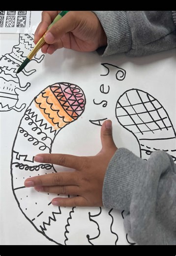 First grade name art practicing using stencils and drawing different types of lines and shapes. Then using watercolors to color it in and while learning about warm and cool colors! #elementaryart #firstgradeart #nameart #watercolors #warmandcoolcolors #stencilart