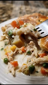 Homestyle Chicken Pot Pie Casserole All the cozy flavors of classic chicken pot pie baked in an easy casserole. Creamy chicken and veggies under a golden biscuit topping. My family loves this one and my kids are always asking for the chicken pie casserole, so it is perfect for a warm, comforting reel. Ingredients: 2 to 3 cups cooked chicken, shredded or diced 2 cups frozen mixed veggies 1 small yellow onion, finely diced 2 cloves garlic, minced 2 cans (10.5 oz each) cream of chicken soup 1 cup c