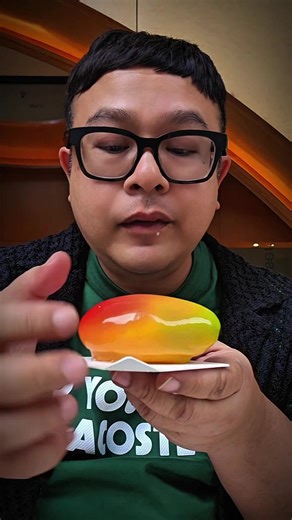 Feels like eating alien fruits! So glossy, pretty yet so delicate! Taste so premium 😋 Best eaten cold for that extra firmness & cruch or eat it on the spot! Available also Hazelnut & Pistachio. I love the mango for it's bursting flavours in my mouth! So alive! 😍 @lacherpatisserie #kualalumpur #malaysia #traveltiktok #solotravel #halal