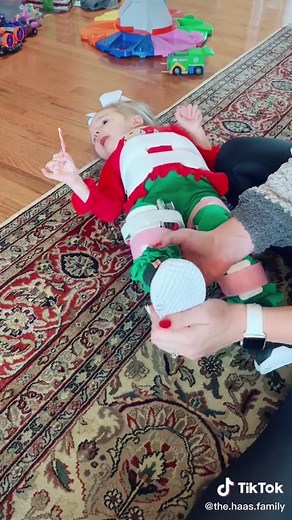 Putting on Riley's Leg Braces for Standing Support