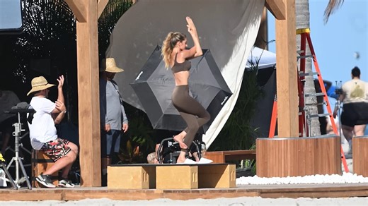 Gisele Bundchen, 45, films workout video in front of film crew on the beach