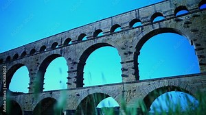 Old Roman stone arch bridge in France as a water pipe of history