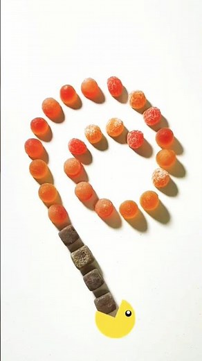 #GreedyPacman dives brown sugar cubes to gulp glowing orange jelly drops #CandySpiral #JellyCandy