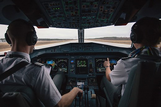 Why do pilots sit on the left seat of the cockpit?